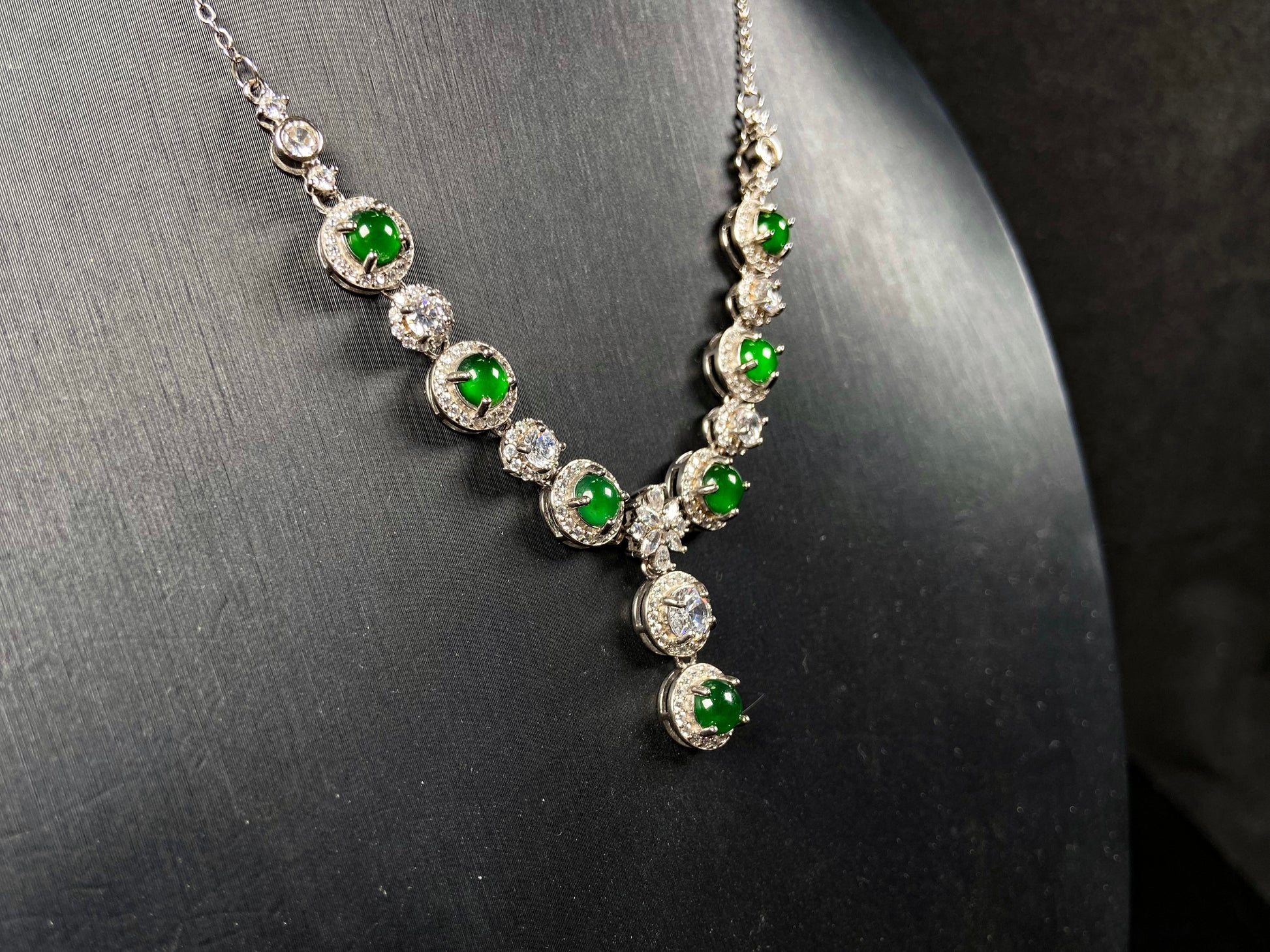 A vibrant green sparkle jadeite pendant.