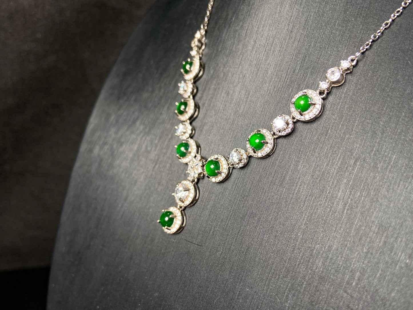 A vibrant green sparkle jadeite pendant.