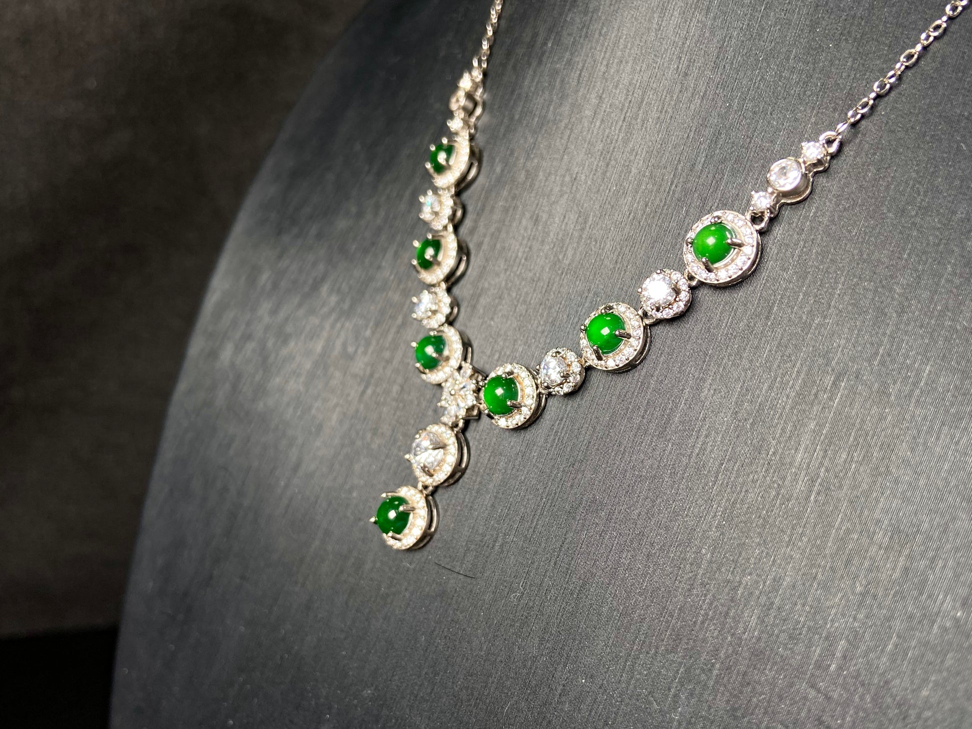 A vibrant green sparkle jadeite pendant.