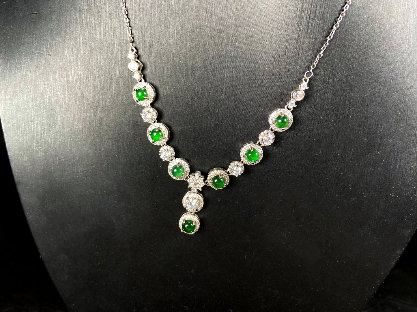 A vibrant green sparkle jadeite pendant.