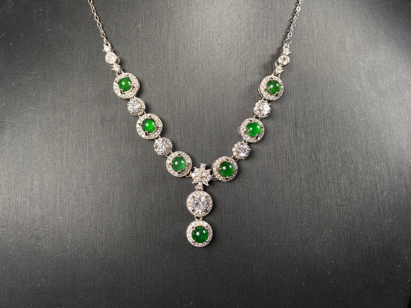 A vibrant green sparkle jadeite pendant.