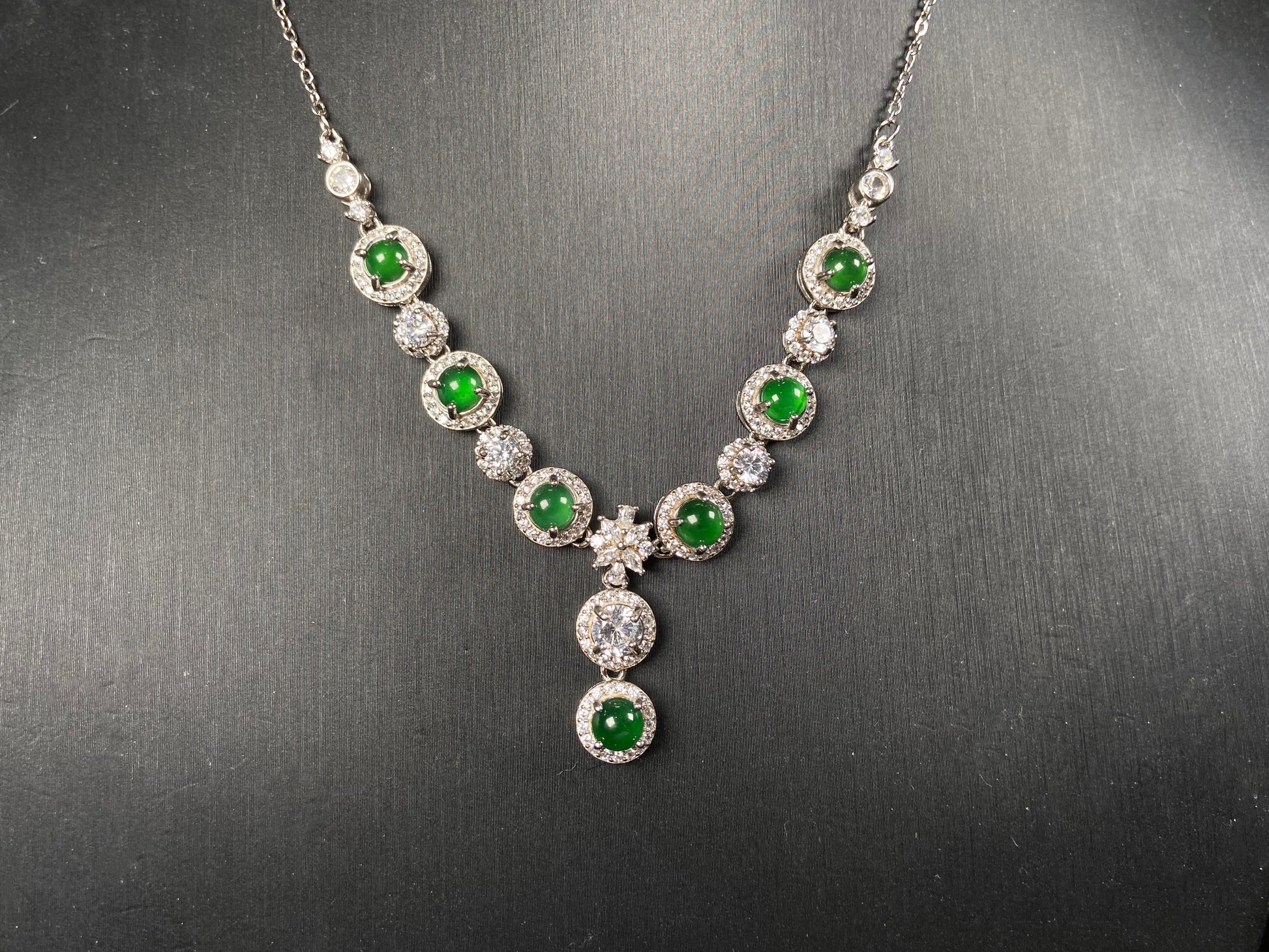 A vibrant green sparkle jadeite pendant.