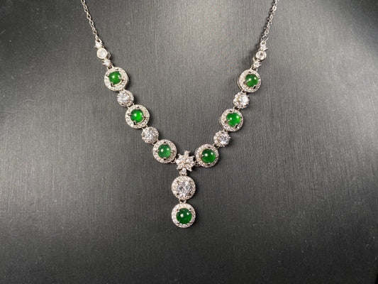 A vibrant green sparkle jadeite pendant.