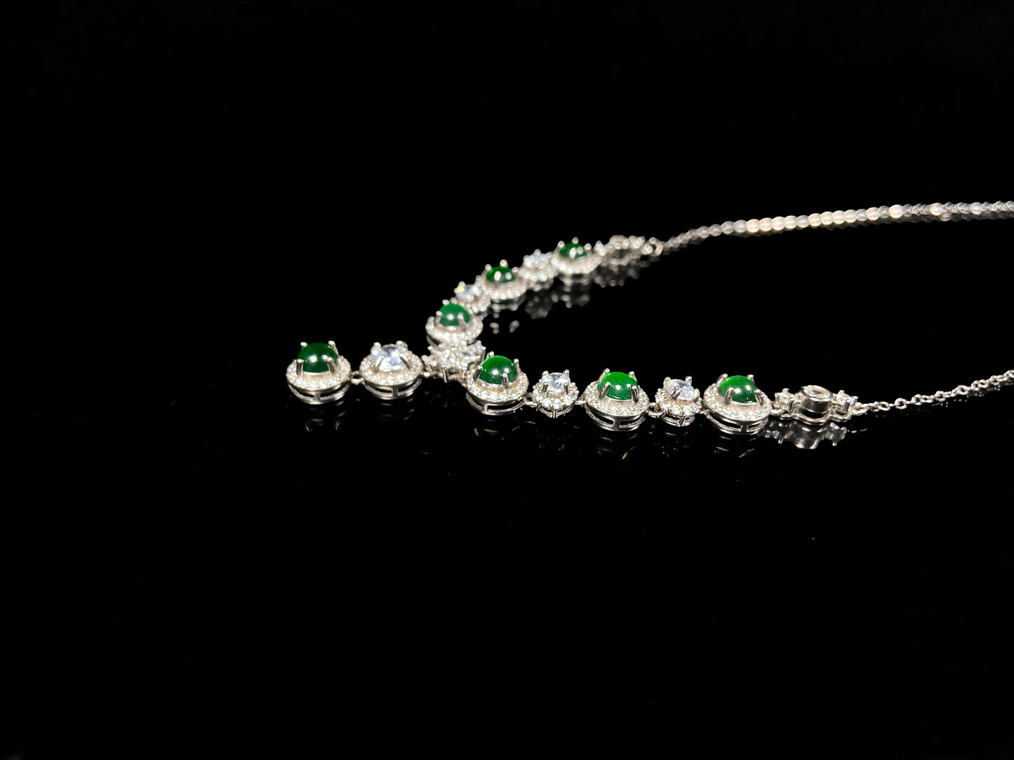 A vibrant green sparkle jadeite pendant.