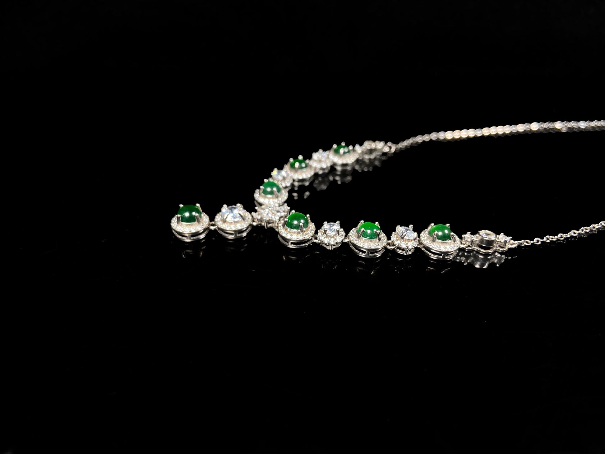 A vibrant green sparkle jadeite pendant.
