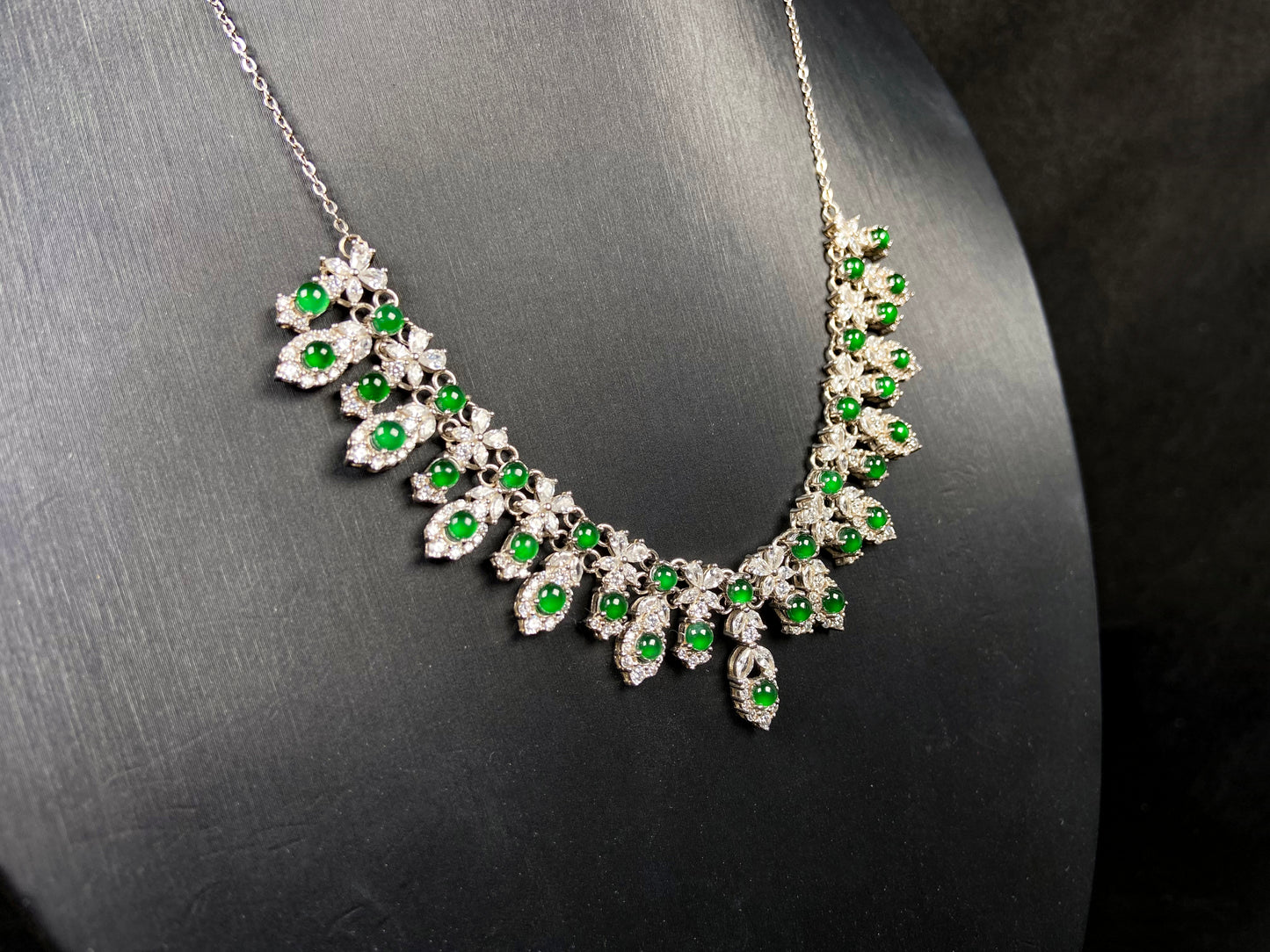 A lush green bloom drape jadeite pendant.