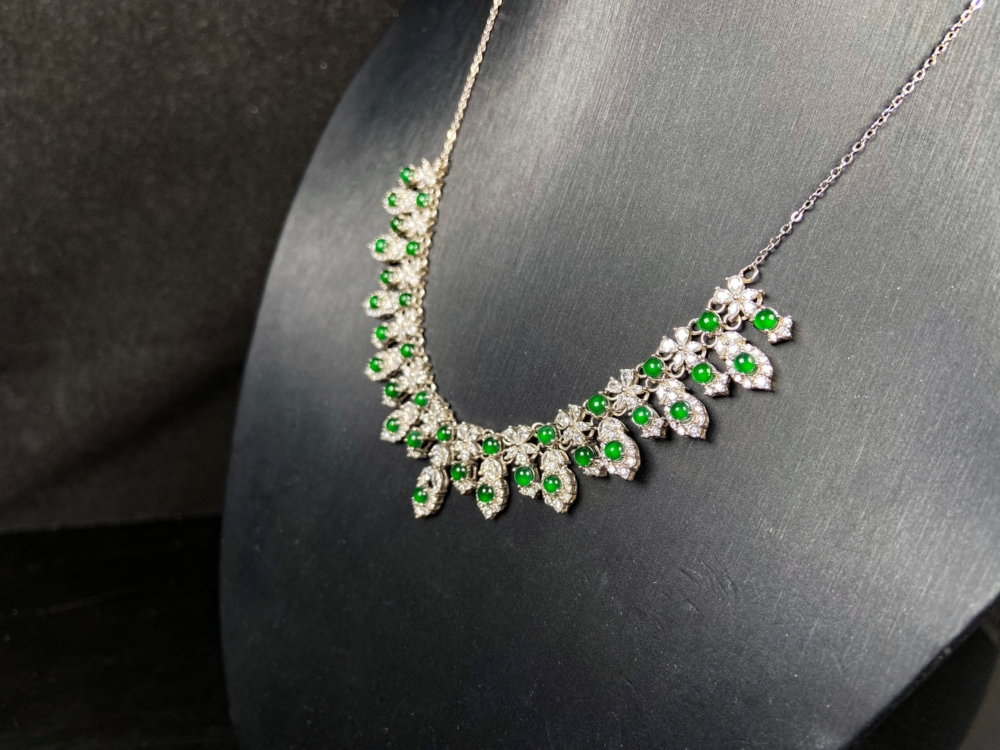 A lush green bloom drape jadeite pendant.