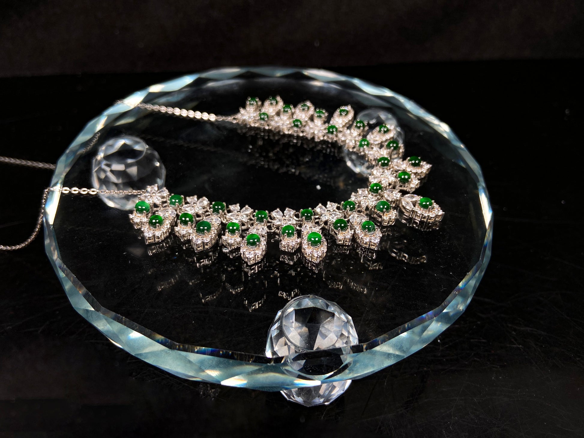 A lush green bloom drape jadeite pendant.