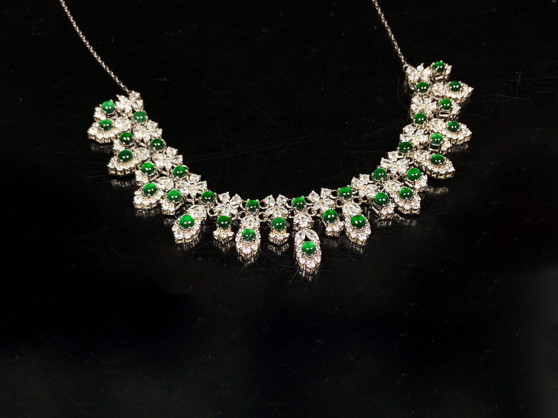 A lush green bloom drape jadeite pendant.