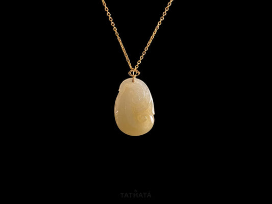 A creamy yellow Ruyi jadeite pendant.