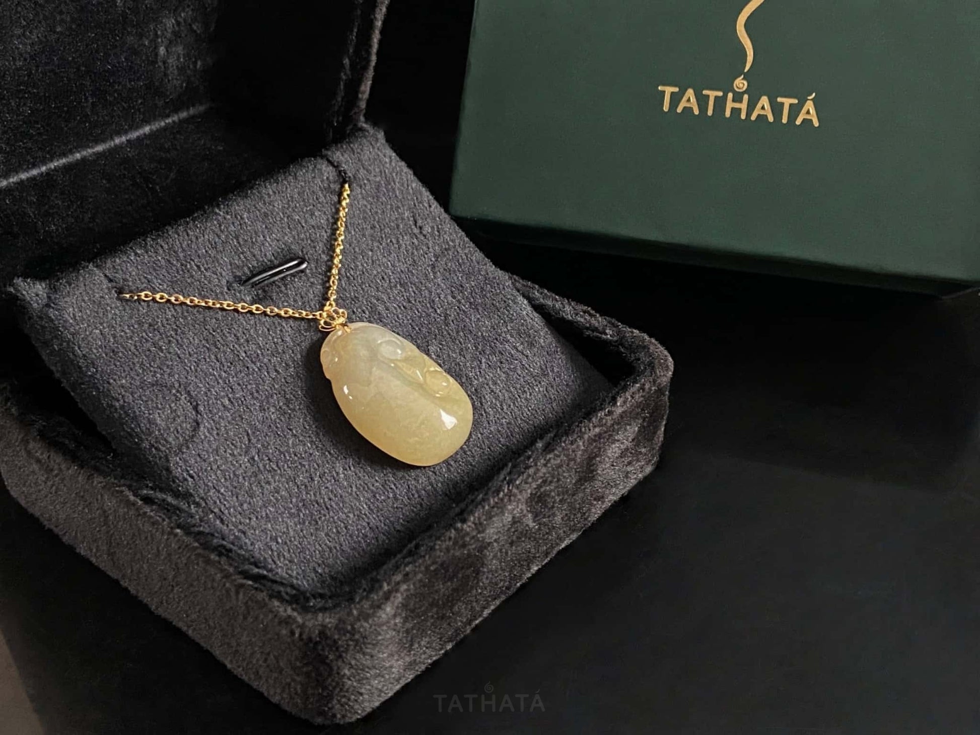 A creamy yellow Ruyi jadeite pendant.
