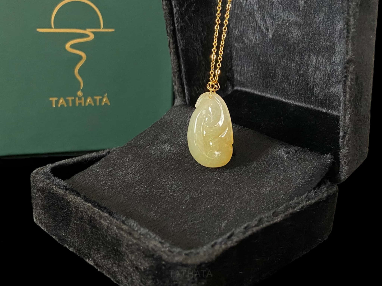A creamy yellow Ruyi jadeite pendant.