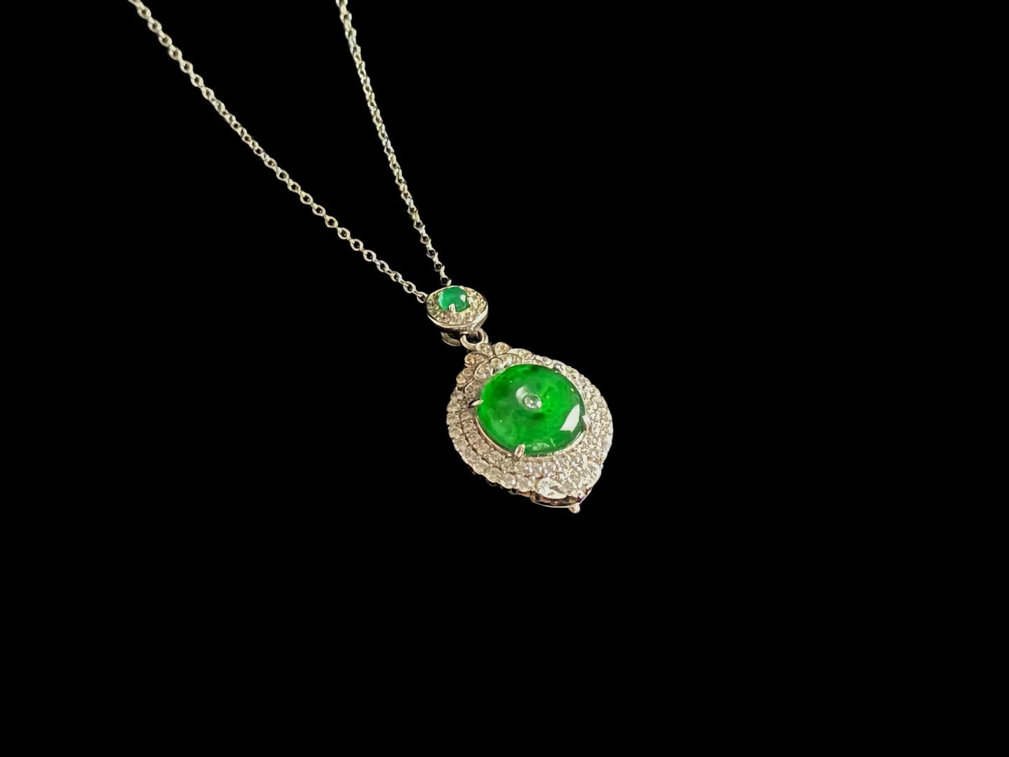 A verdant halo peace disc jadeite pendant.