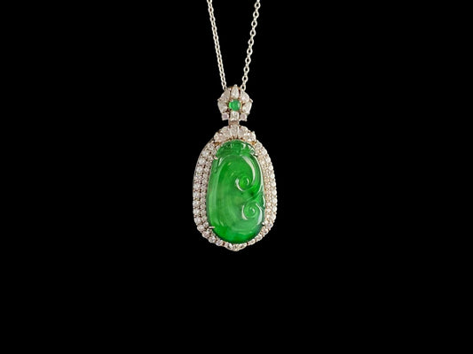 A vivid green spirit Ruyi jadeite pendant.