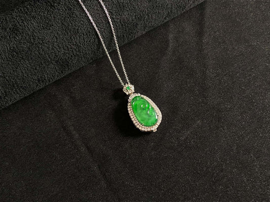 A vivid green spirit Ruyi jadeite pendant.