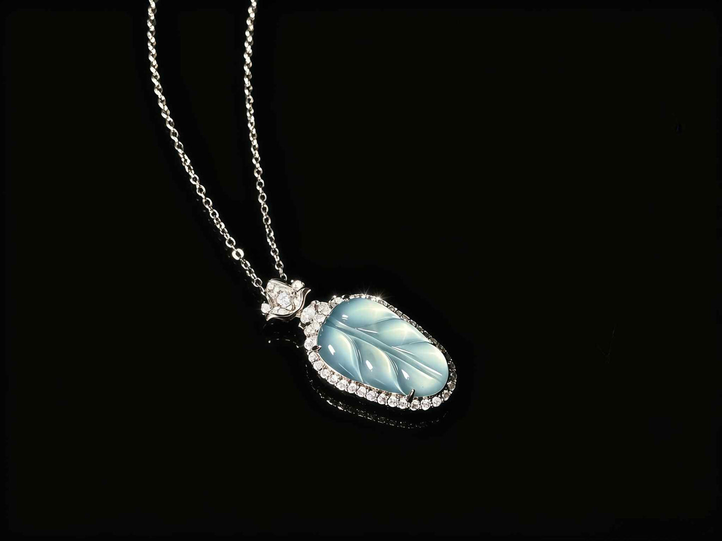 A clear ice blue leaf jadeite pendant.