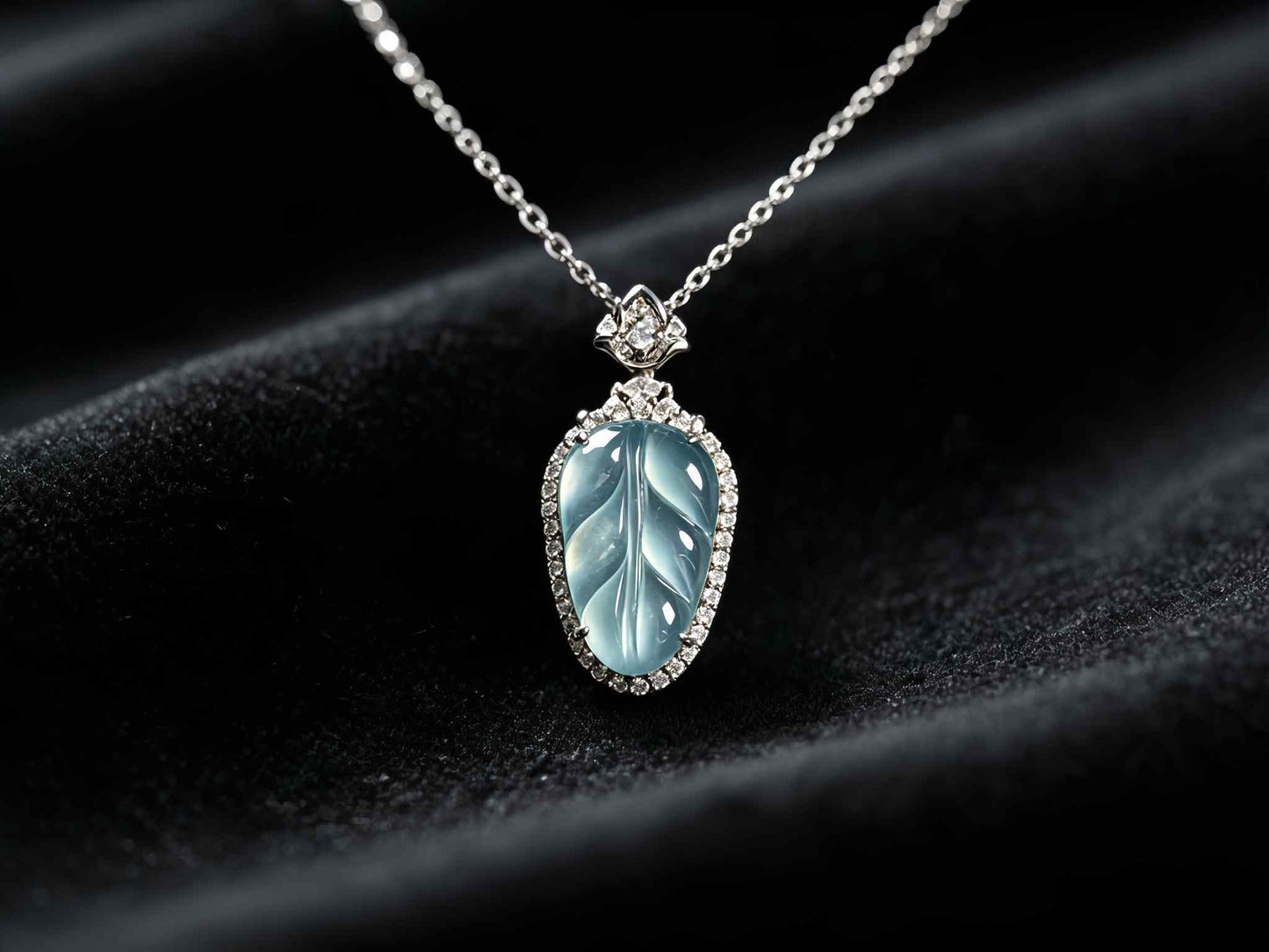 A clear ice blue leaf jadeite pendant.