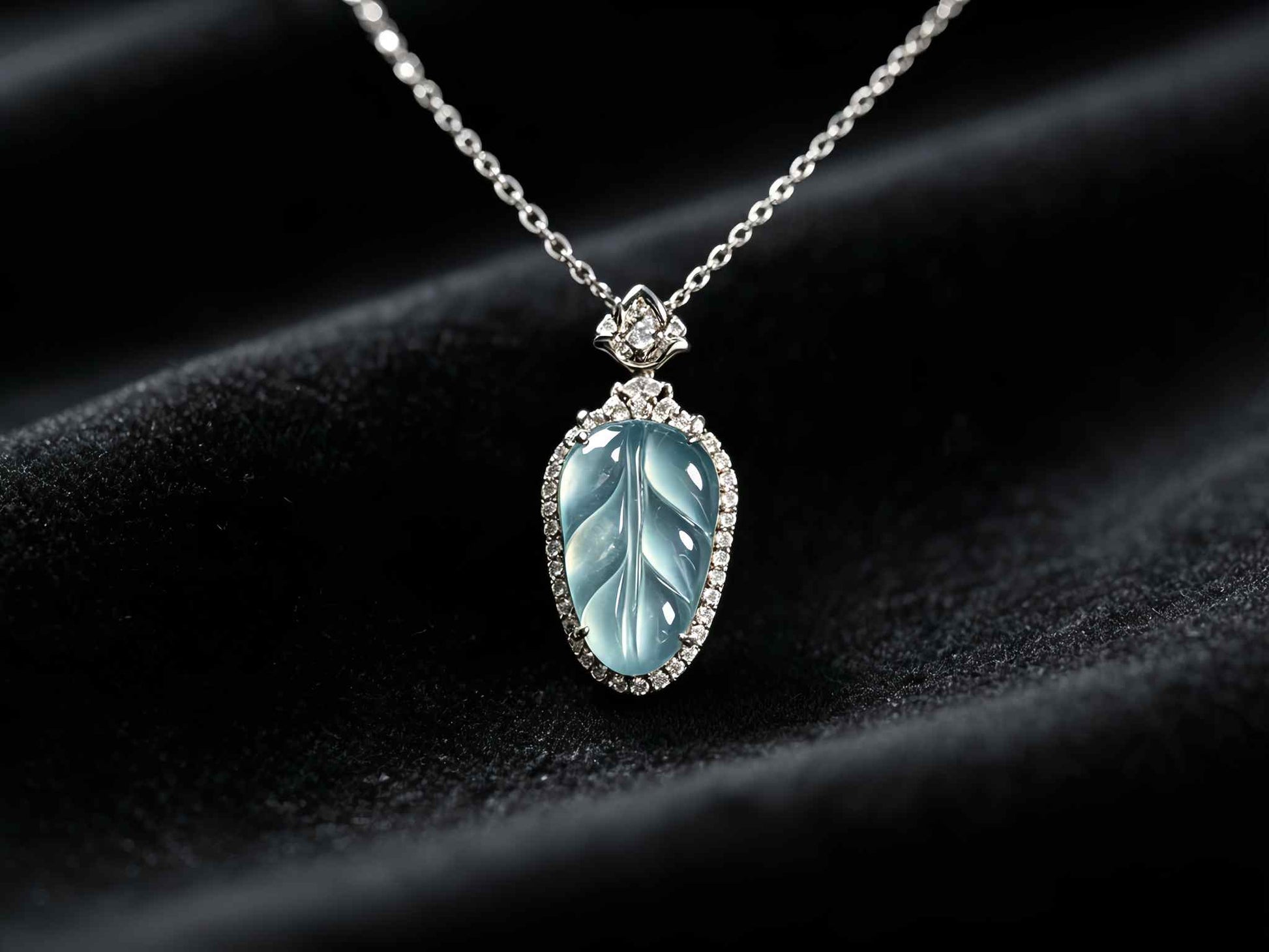 A clear ice blue leaf jadeite pendant.