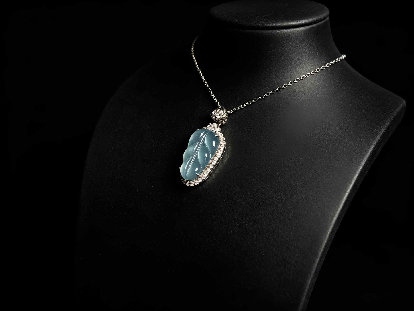A clear ice blue leaf jadeite pendant.