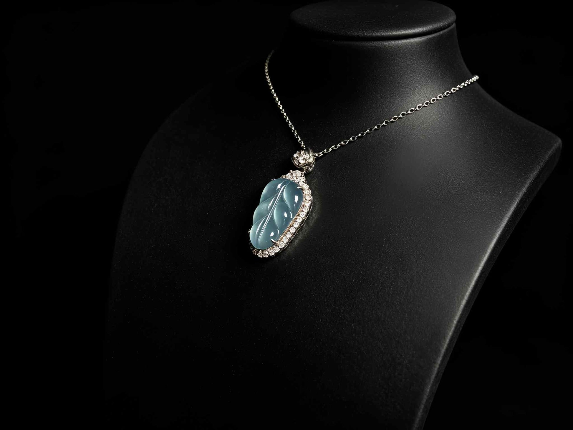 A clear ice blue leaf jadeite pendant.