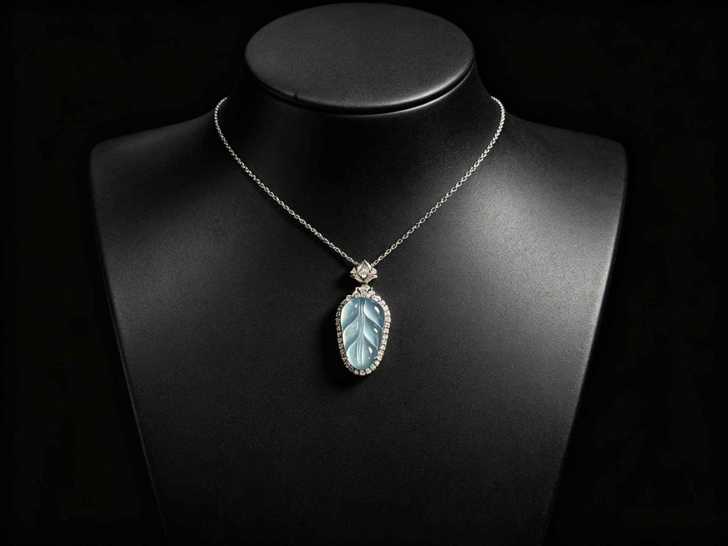 A clear ice blue leaf jadeite pendant.