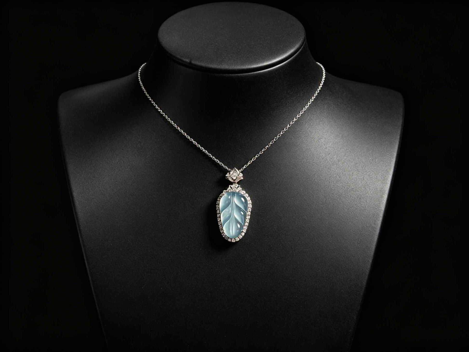 A clear ice blue leaf jadeite pendant.