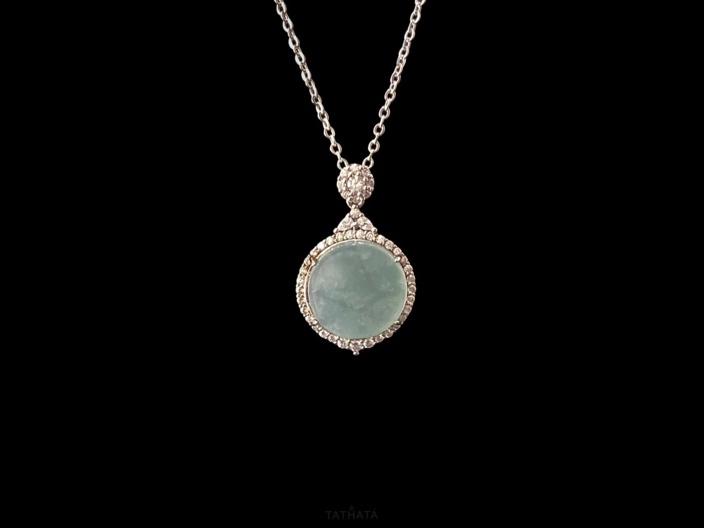 A mint dew disk jadeite pendant.
