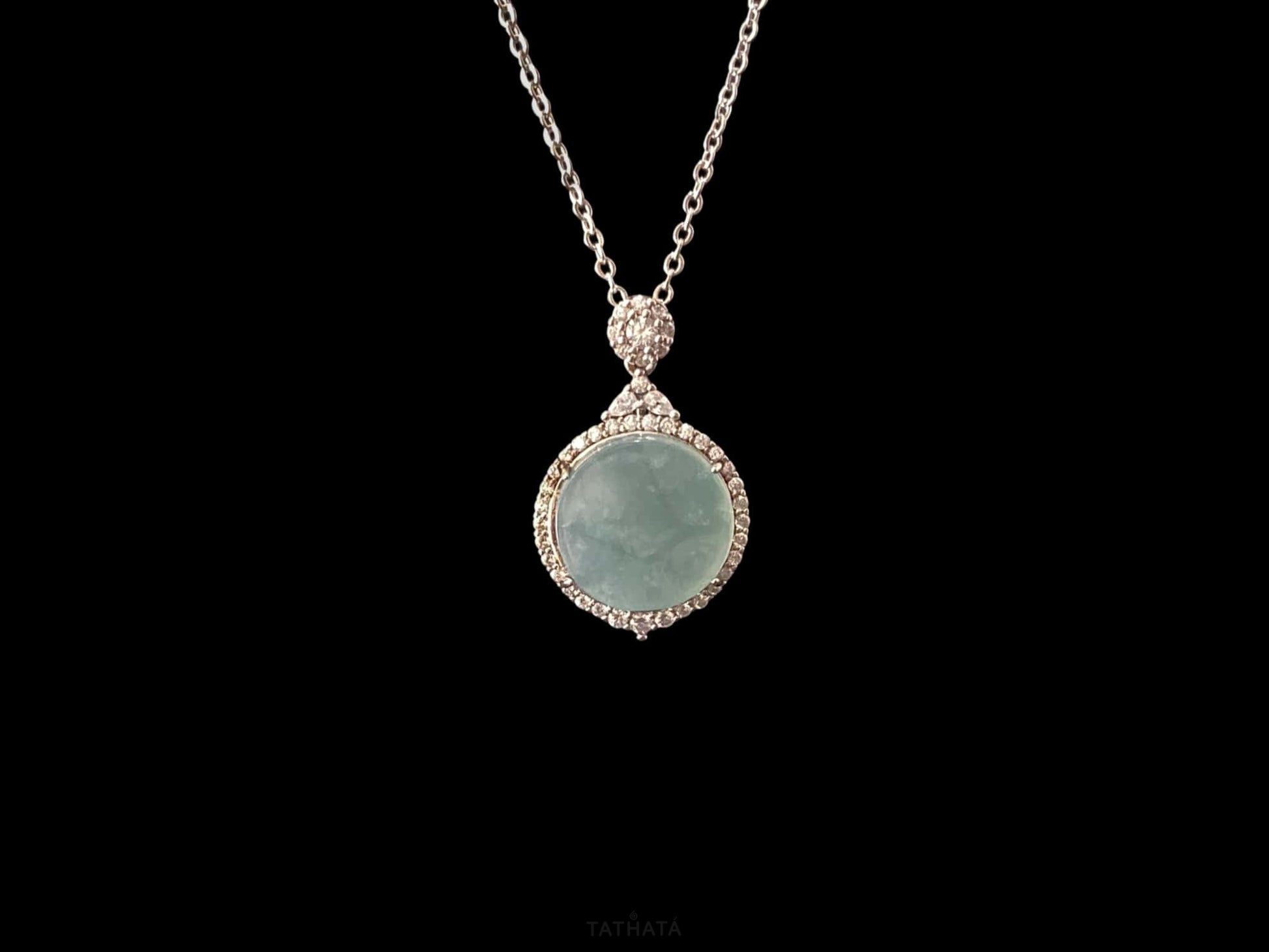 A mint dew disk jadeite pendant.