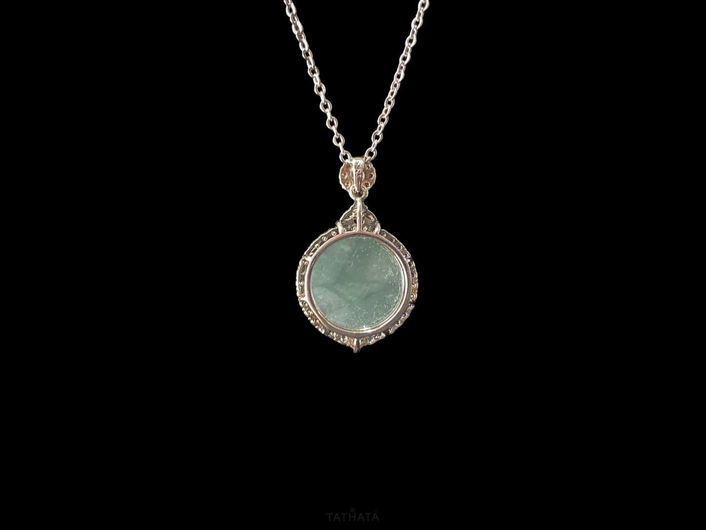 A mint dew disk jadeite pendant.