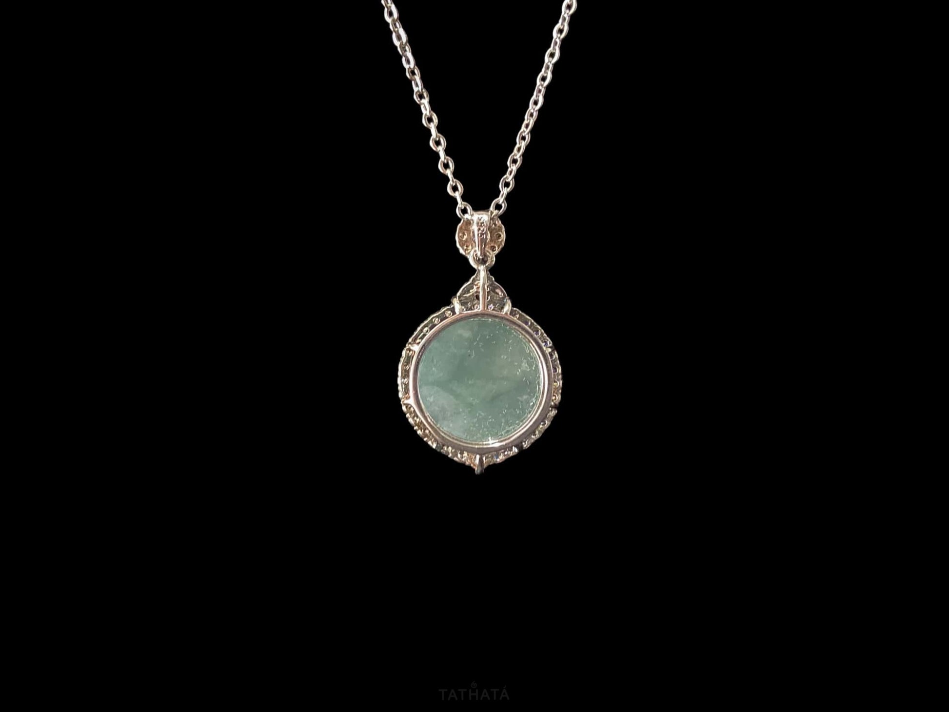 A mint dew disk jadeite pendant.