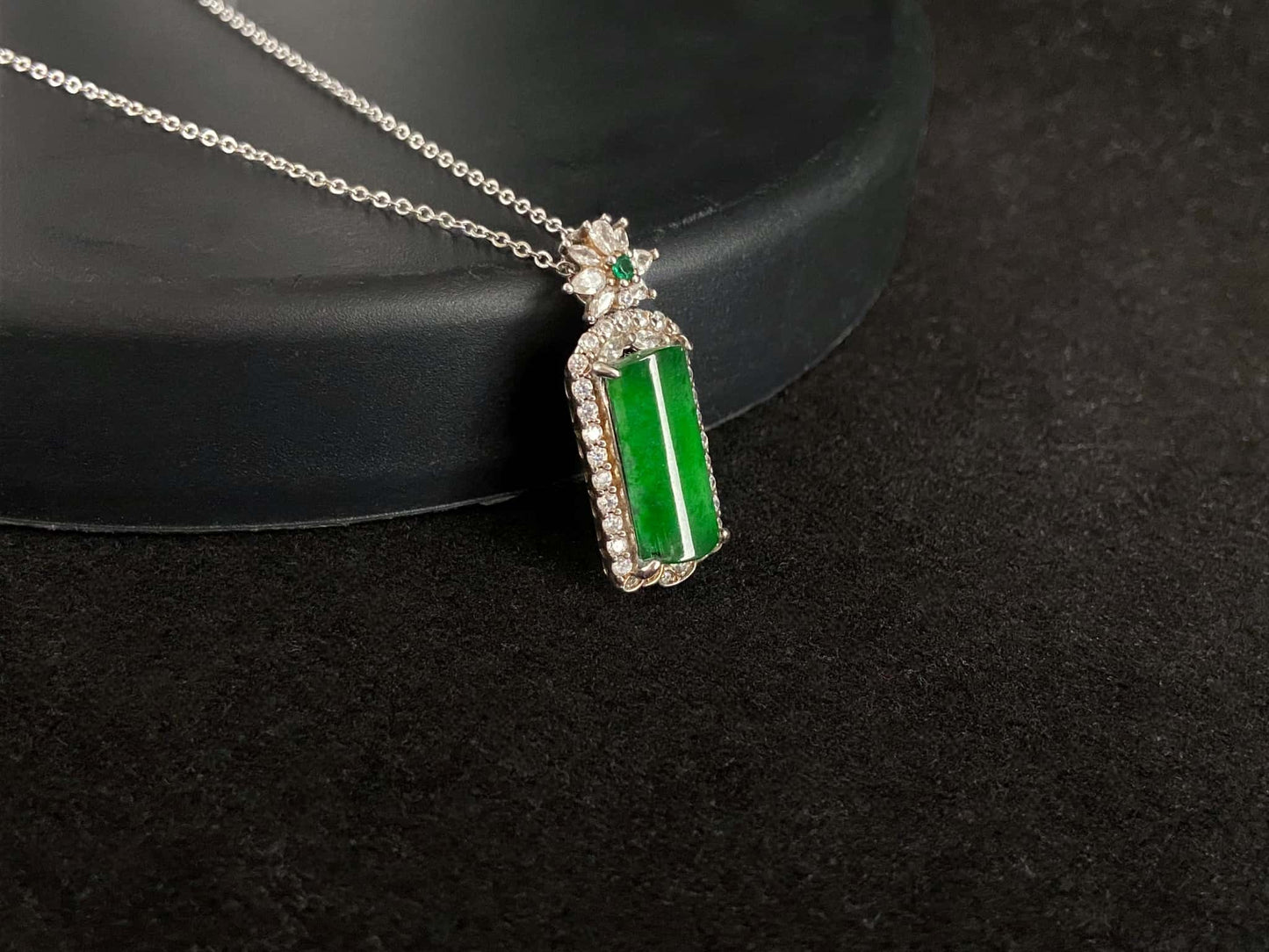 A rich green star frame jadeite pendant.