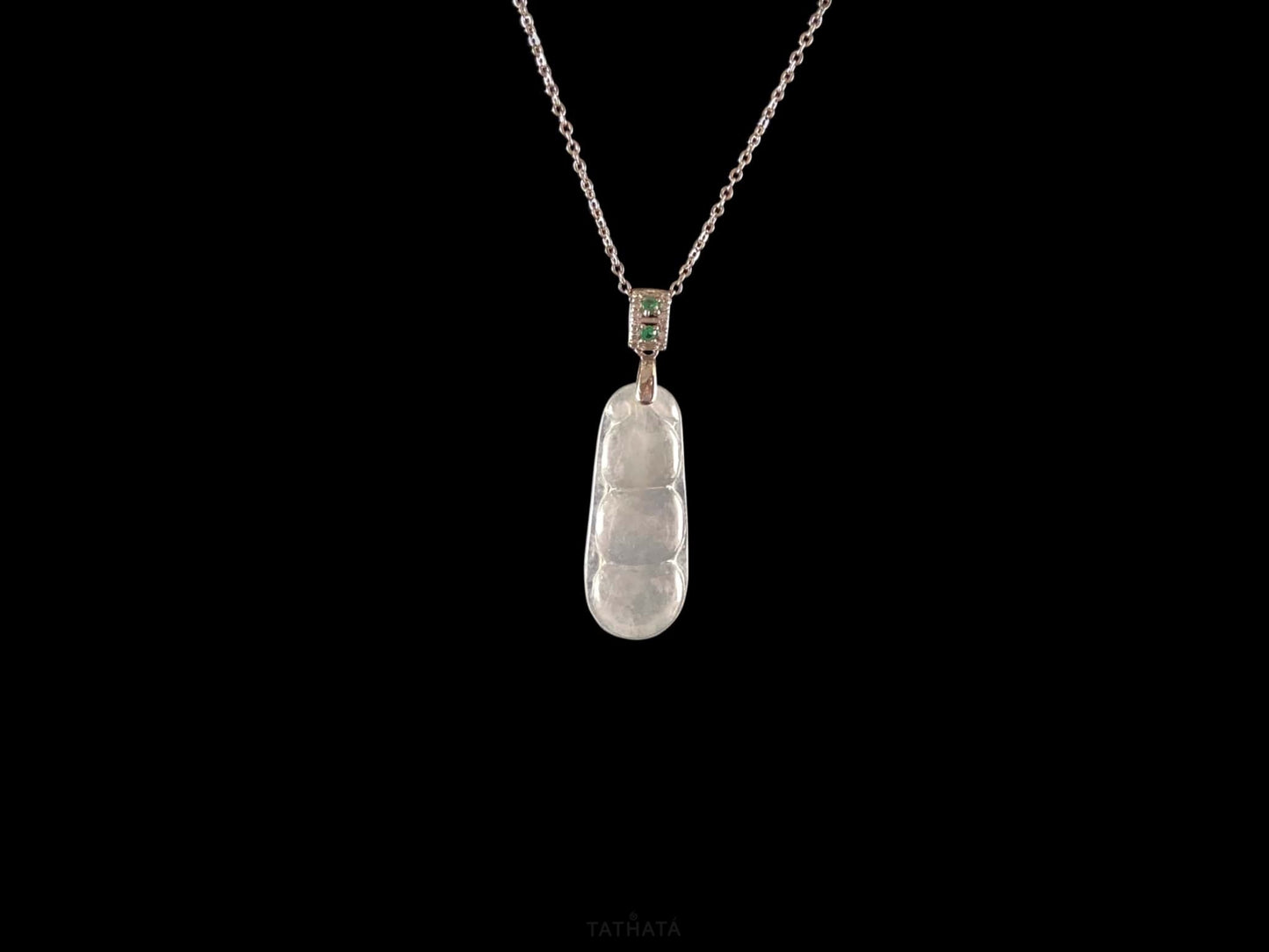 A glacial green bean jadeite pendant.