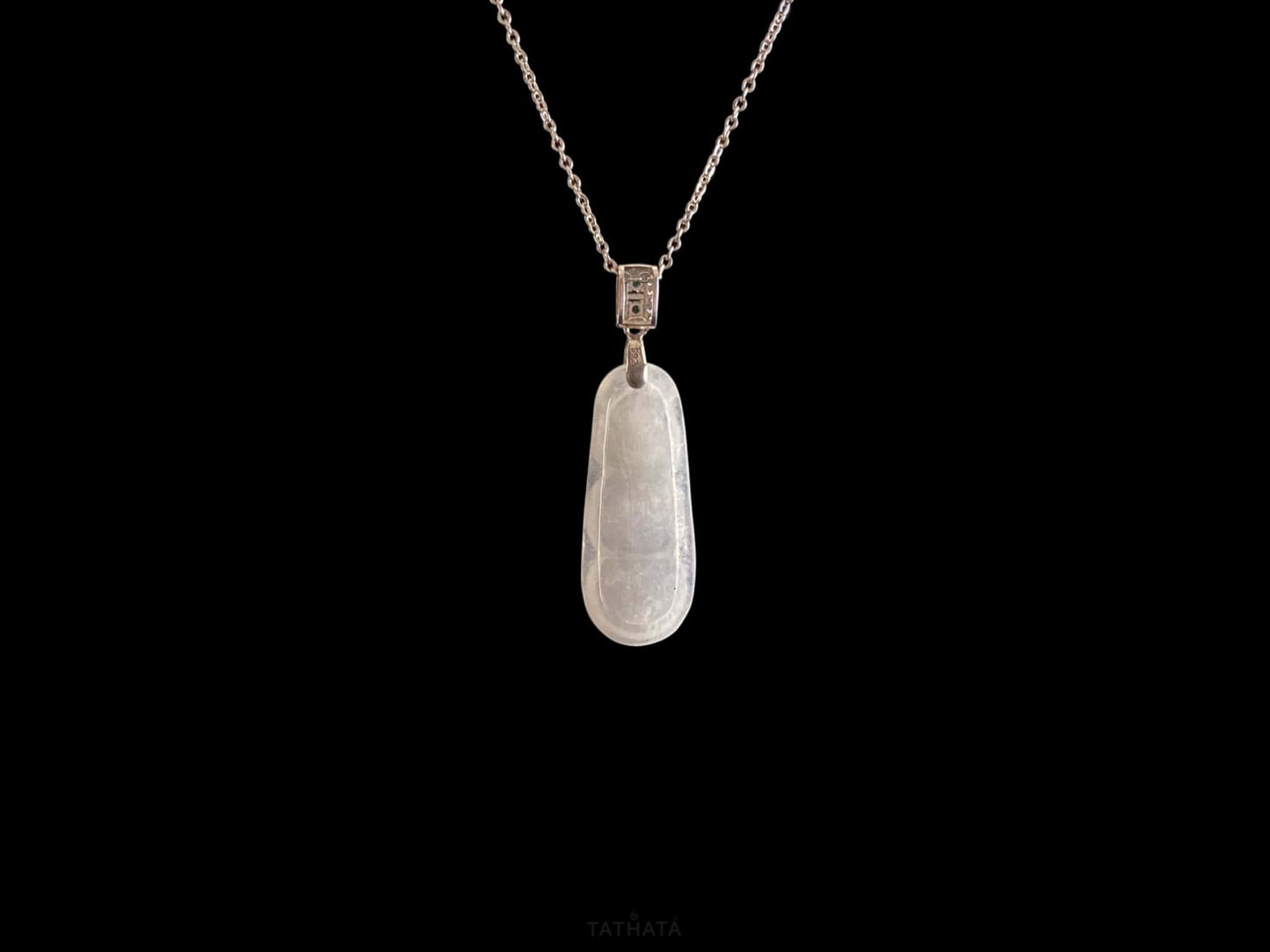 A glacial green bean jadeite pendant.