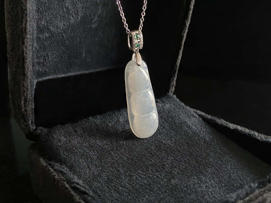 A glacial green bean jadeite pendant.