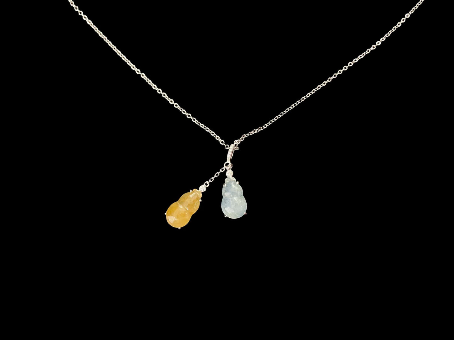 A sun and moon twin gourds jadeite pendant.