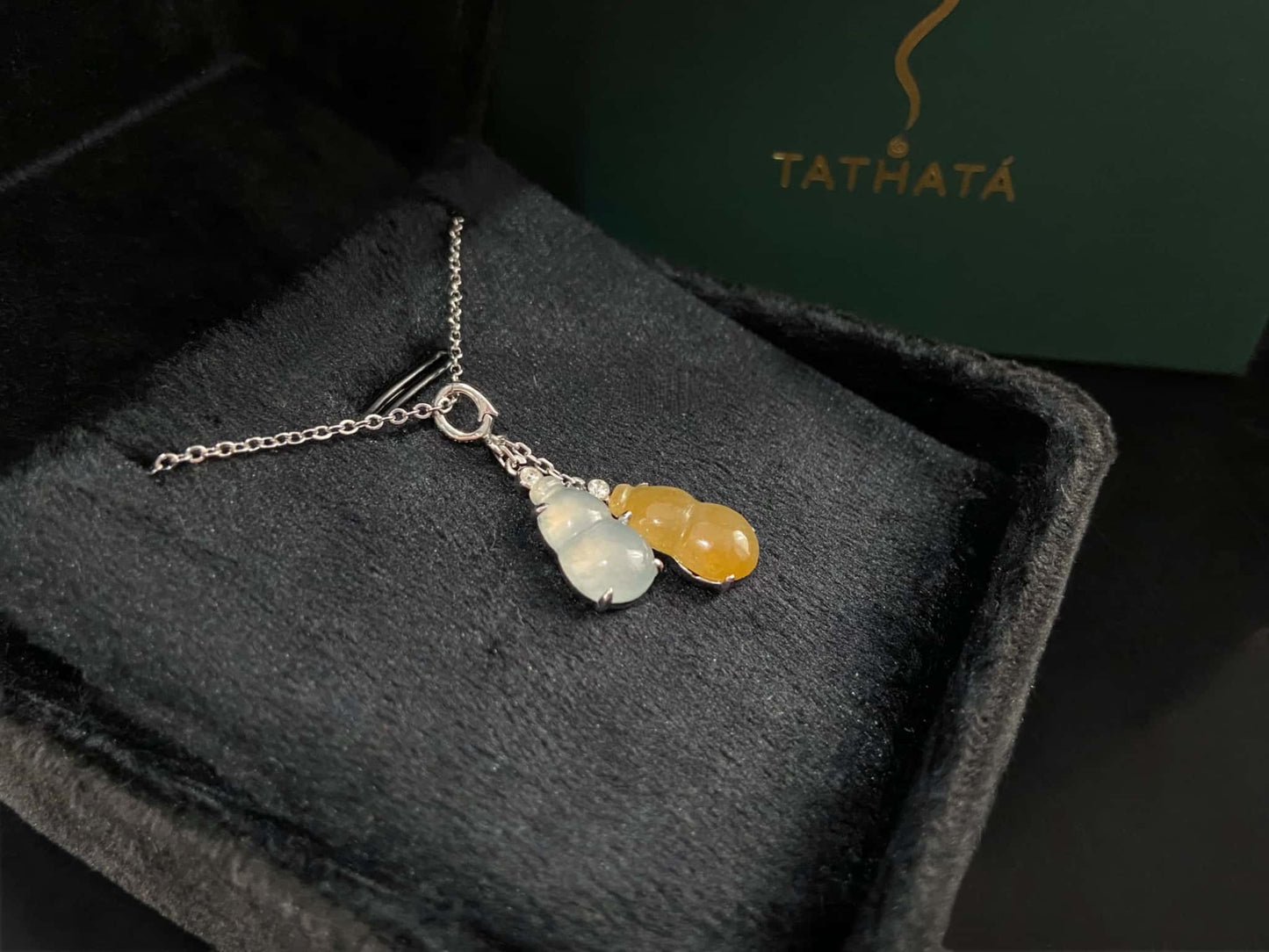 A sun and moon twin gourds jadeite pendant.