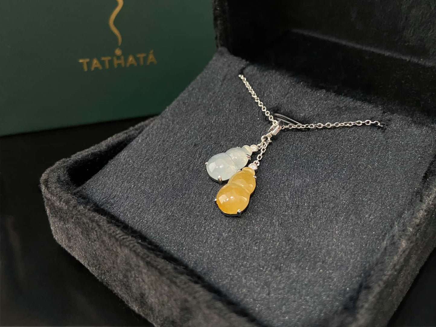 A sun and moon twin gourds jadeite pendant.