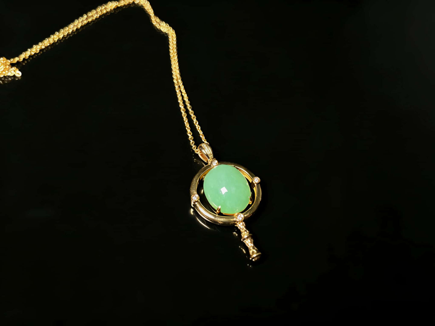 A apple green star finder jadeite pendant.