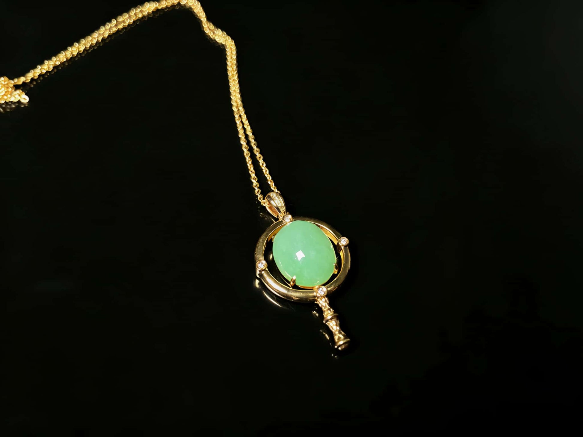 A apple green star finder jadeite pendant.