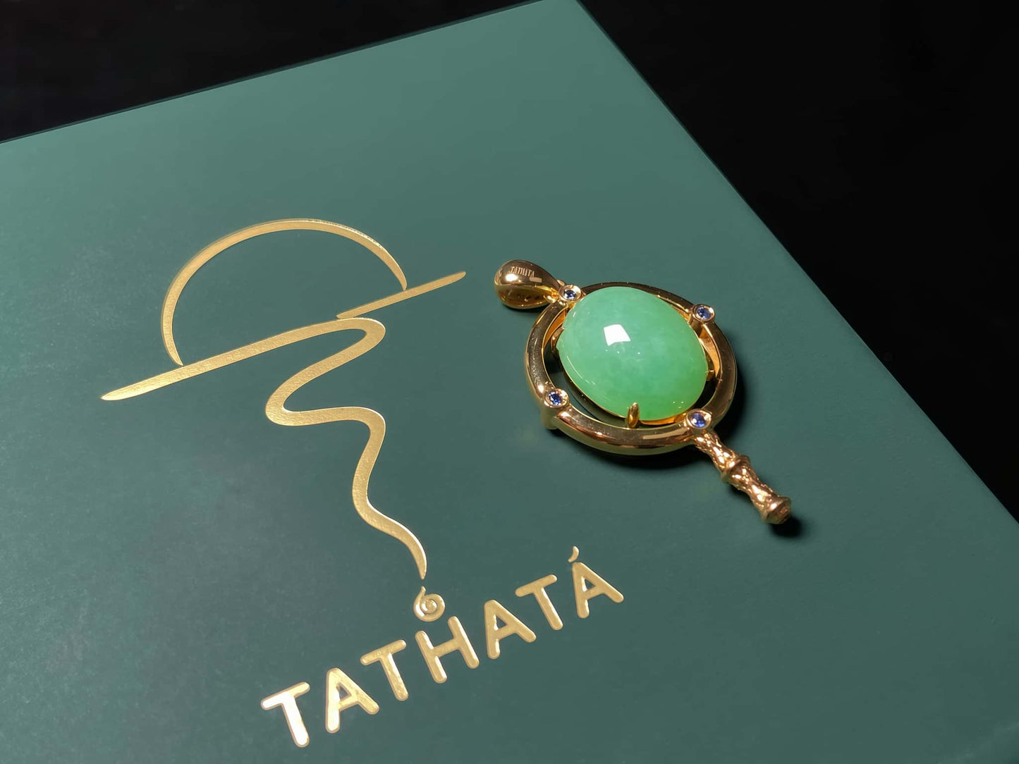 A apple green star finder jadeite pendant.