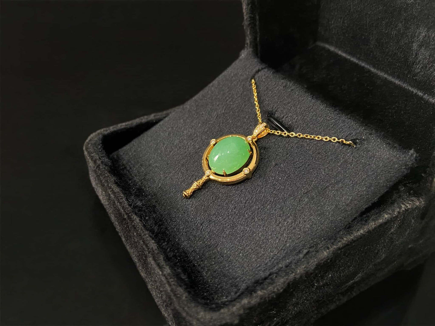 A apple green star finder jadeite pendant.