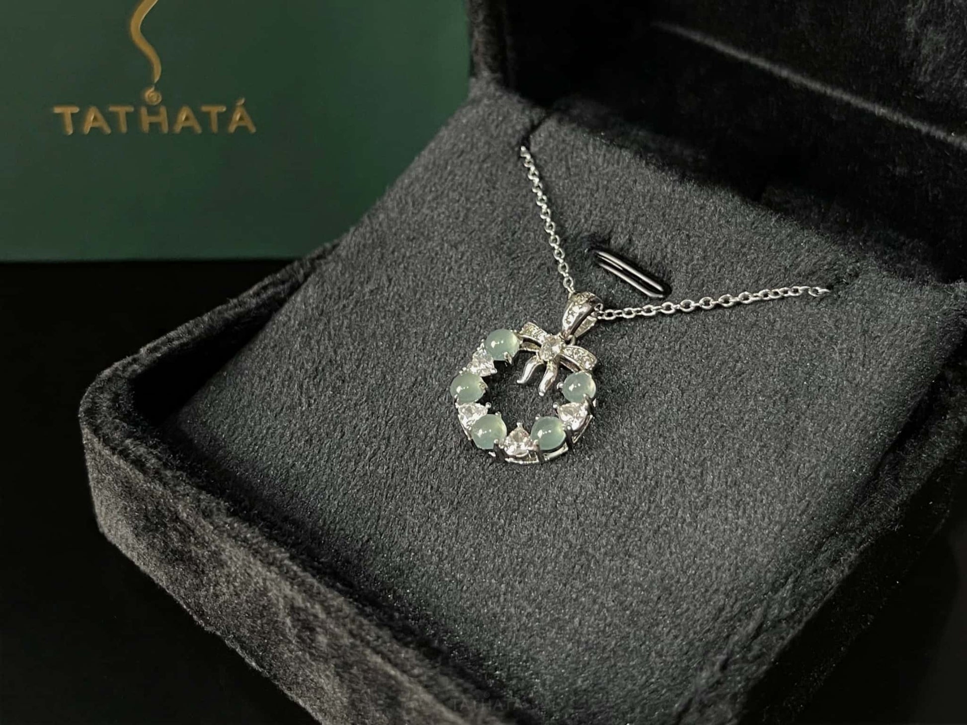 A icy bow wreath jadeite pendant.