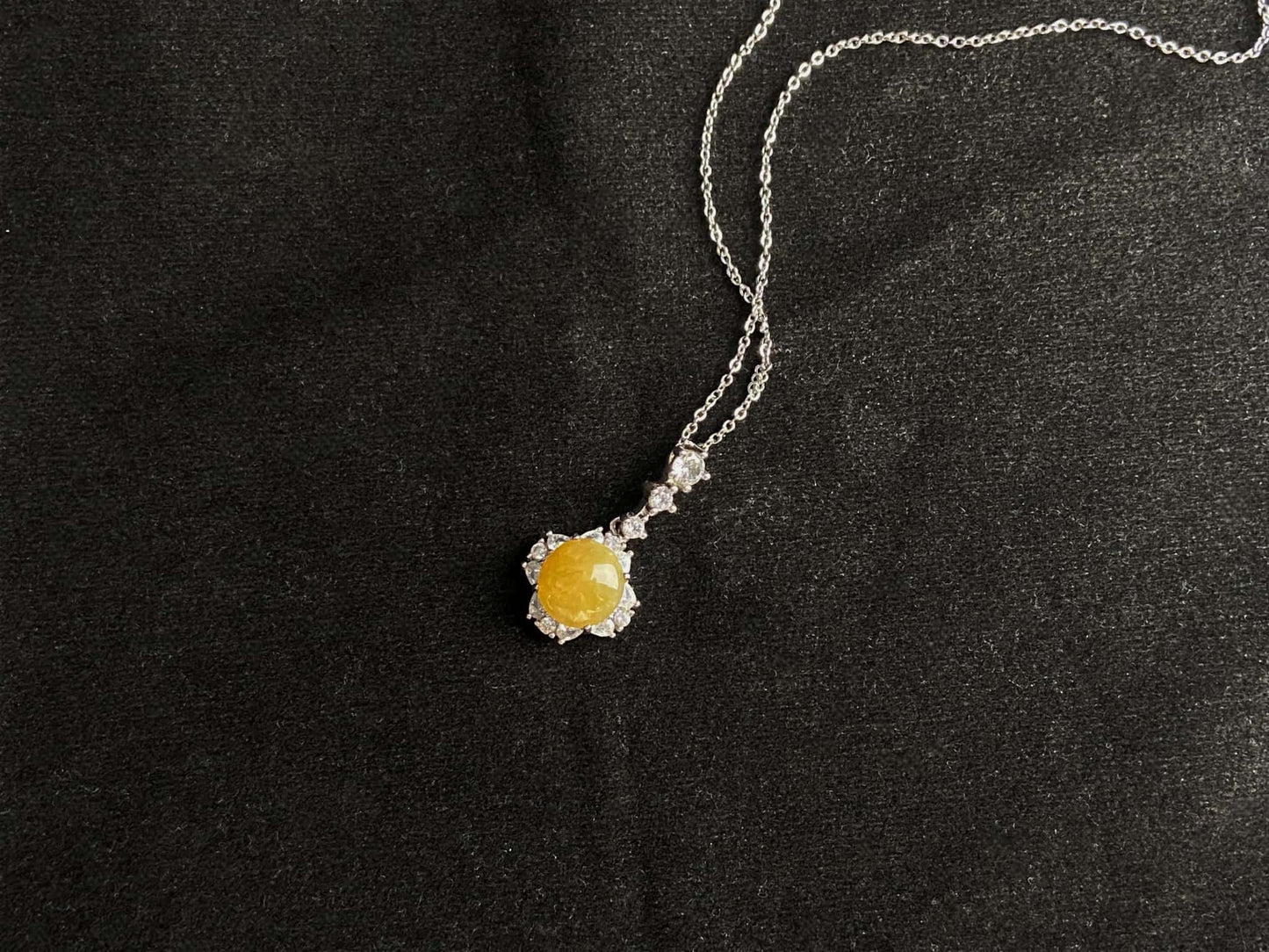 A warm sunlit core jadeite pendant.