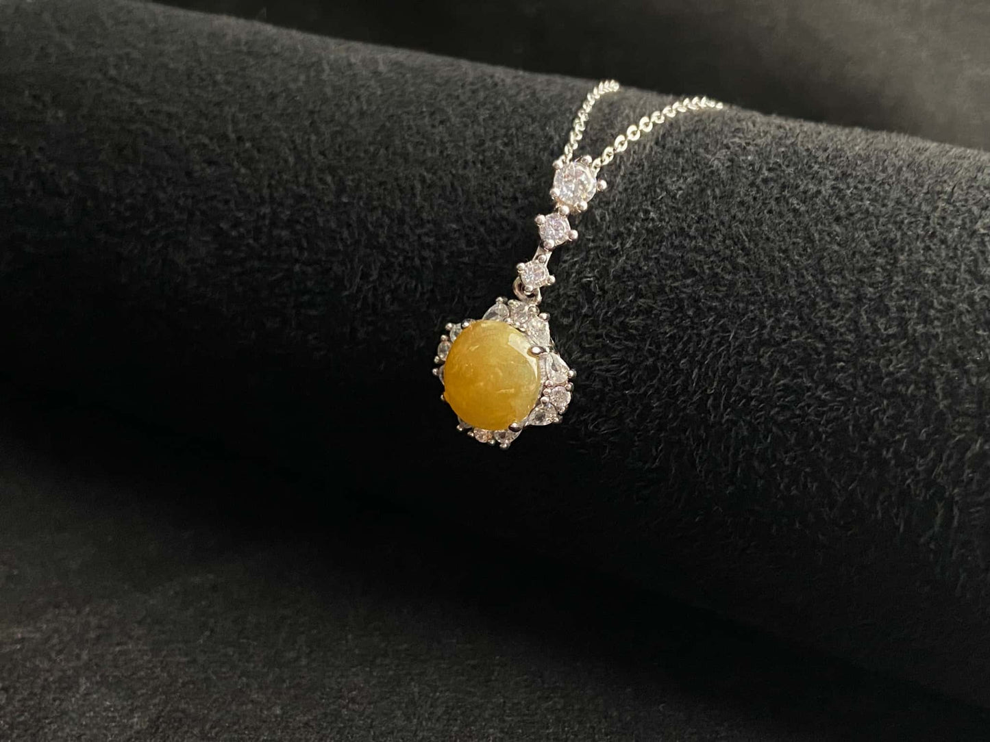 A warm sunlit core jadeite pendant.