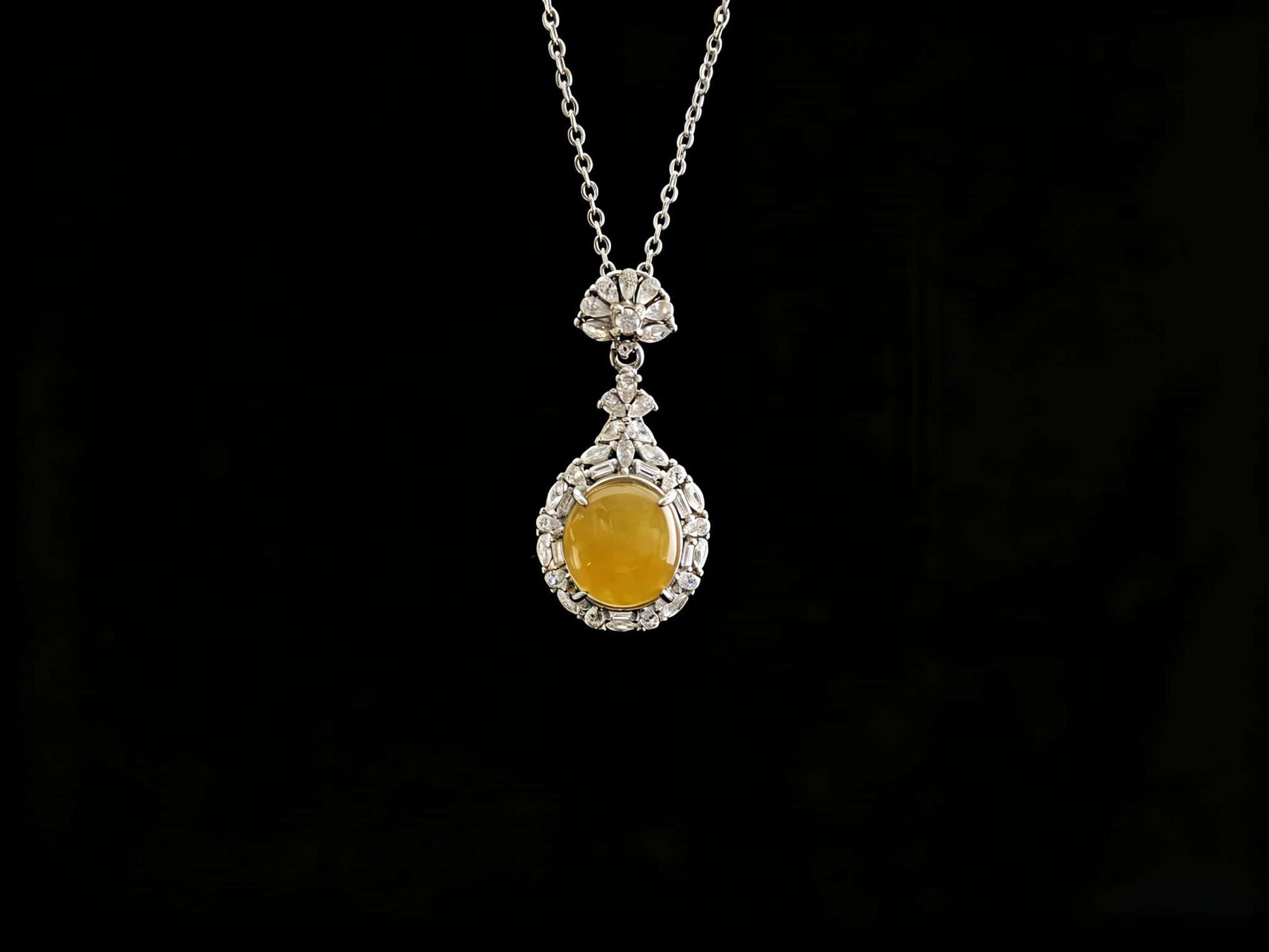 A sunset warm gold sparkle jadeite pendant.