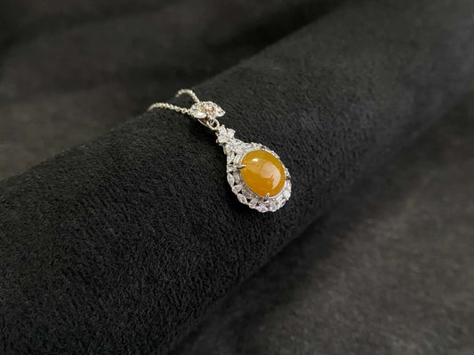 A sunset warm gold sparkle jadeite pendant.