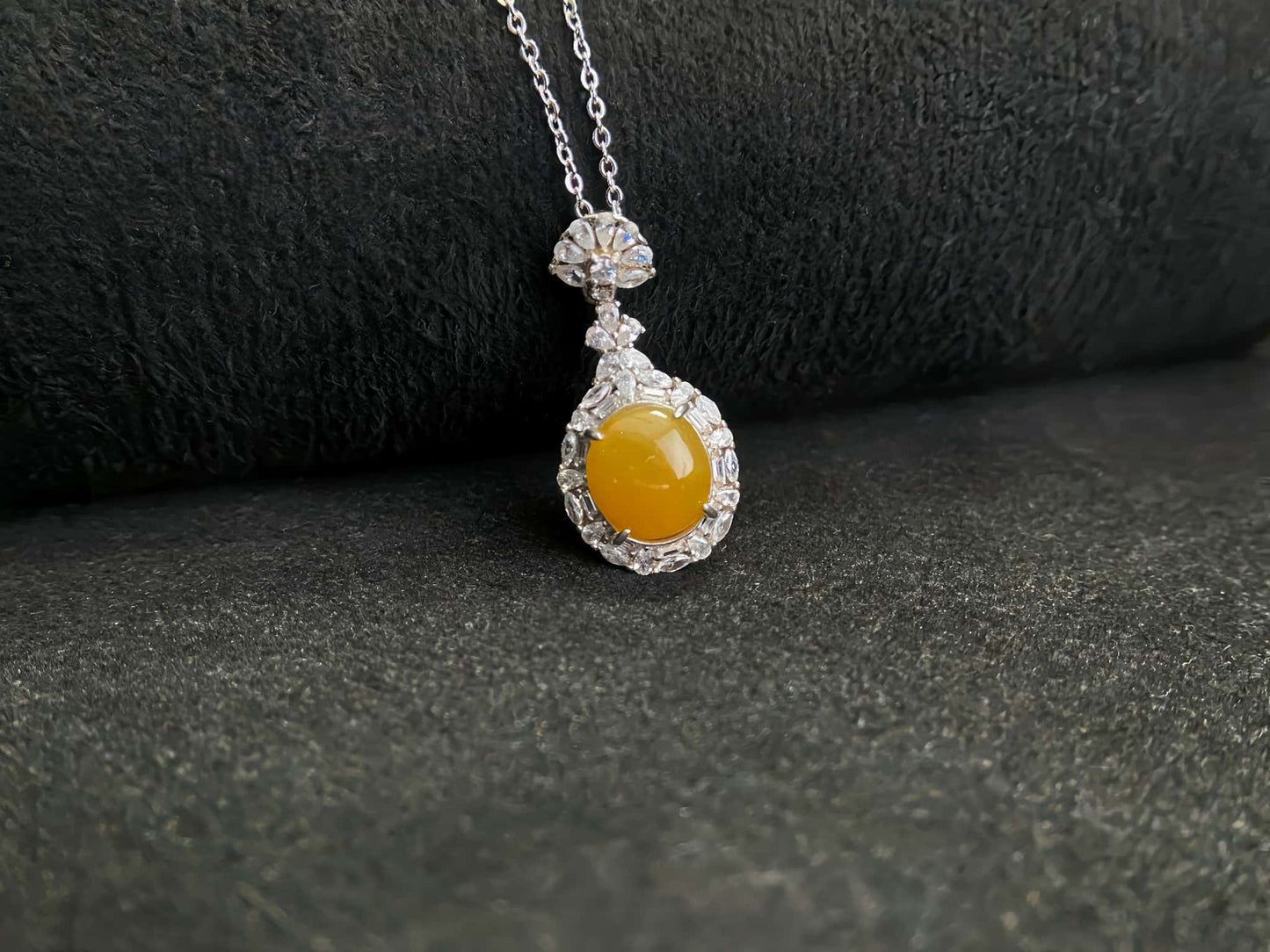 A sunset warm gold sparkle jadeite pendant.