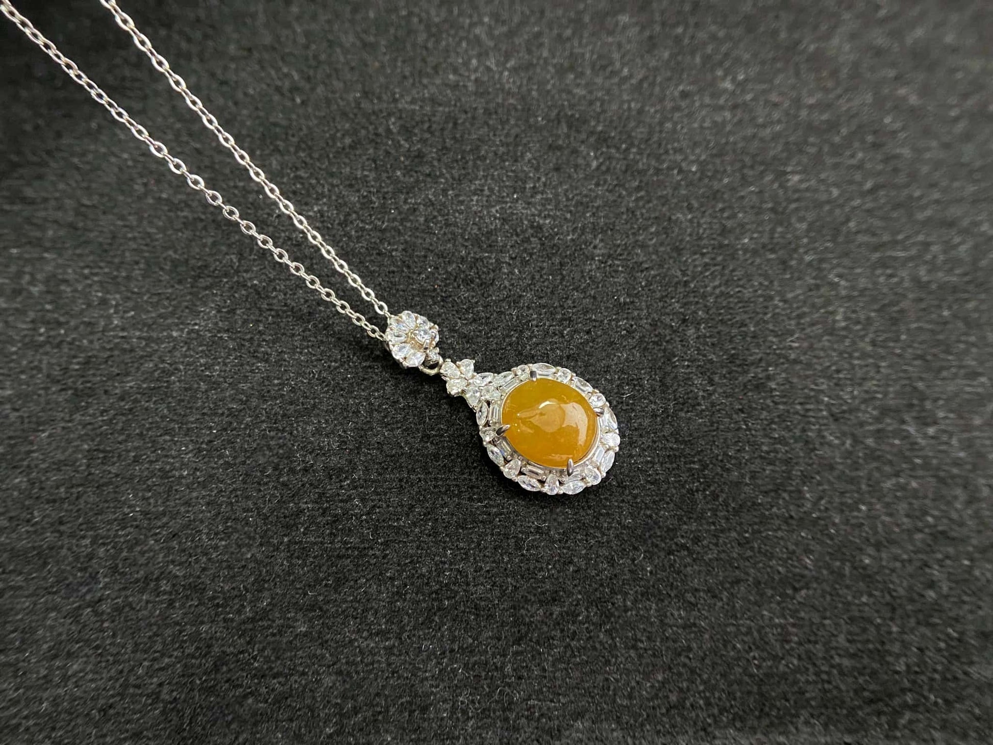 A sunset warm gold sparkle jadeite pendant.