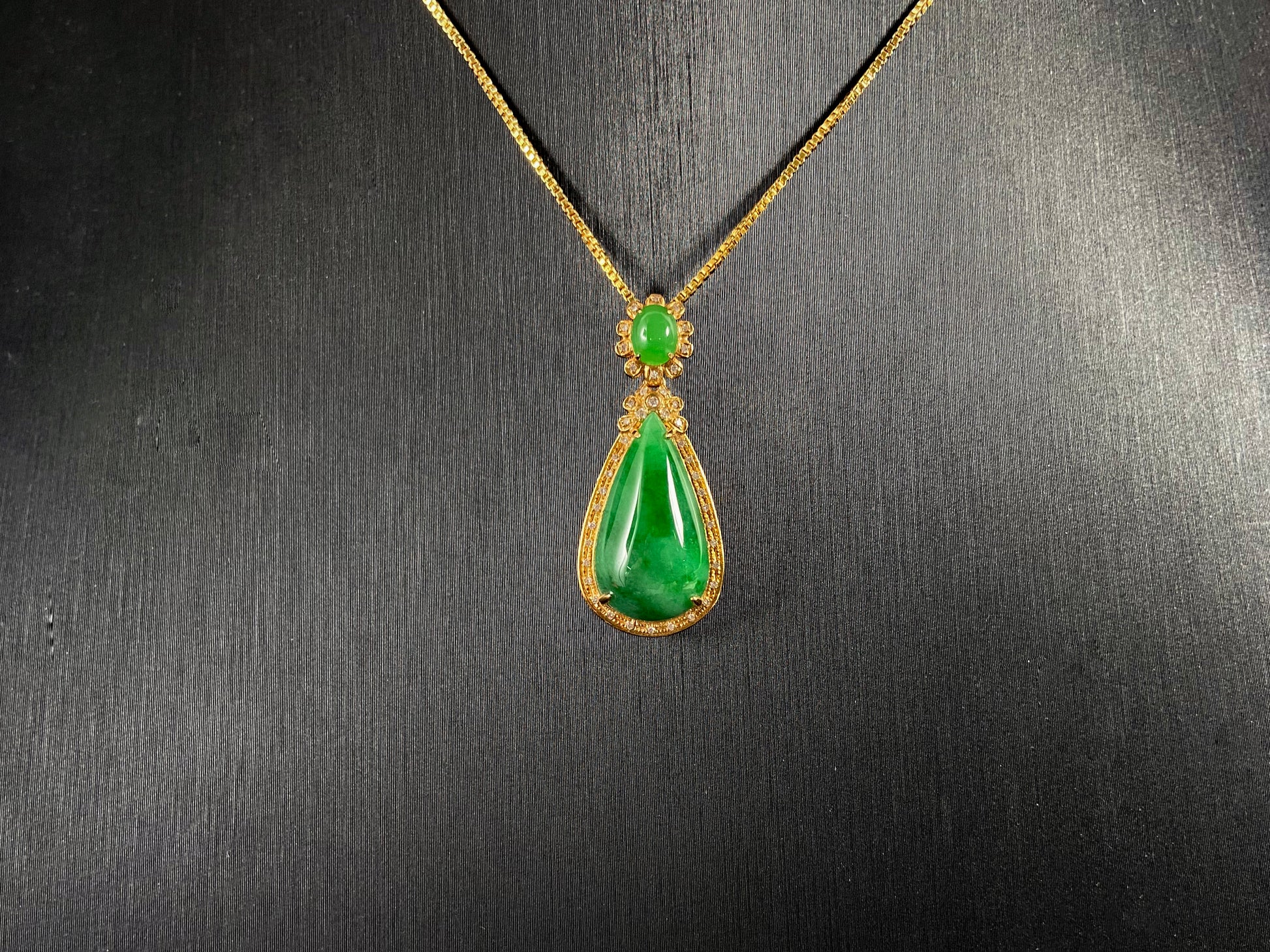 Imperial Jadeite meets sterling silver in this elegant pendant, masterfully uniting an oval and teardrop in one harmonious design.