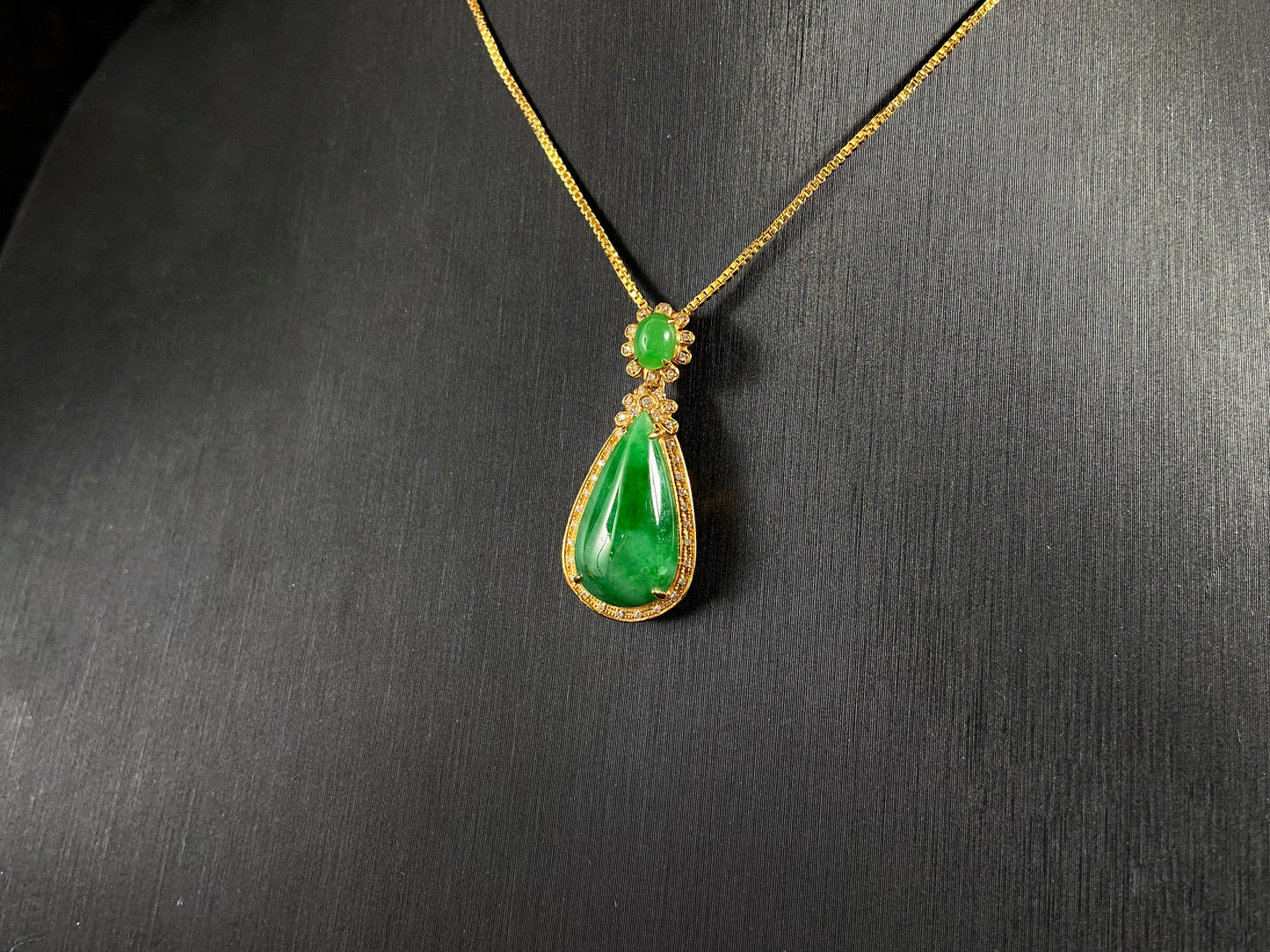 Imperial Jadeite meets sterling silver in this elegant pendant, masterfully uniting an oval and teardrop in one harmonious design.